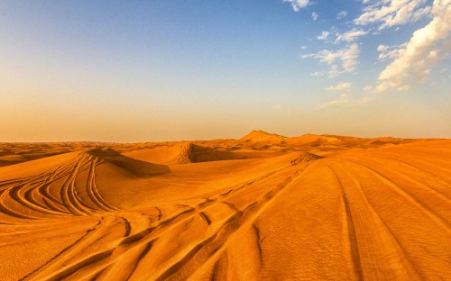 Image brown sand under blue sky during daytime