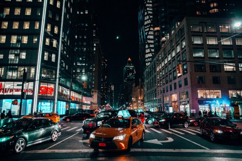 Image cars on road in city during night time