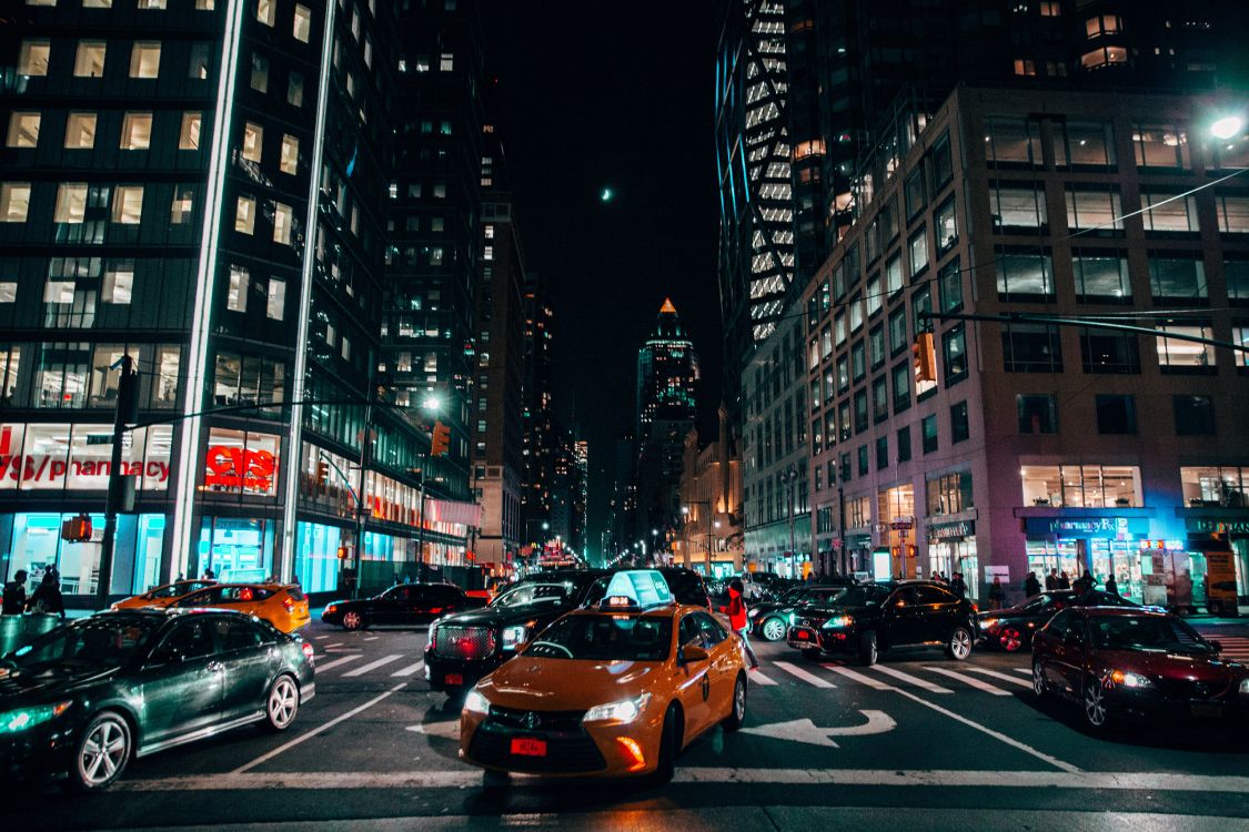 cars on road in city during night time