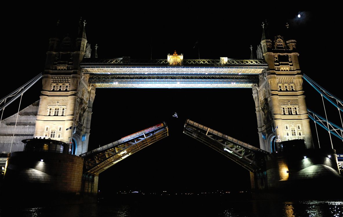 white and brown concrete bridge during night time