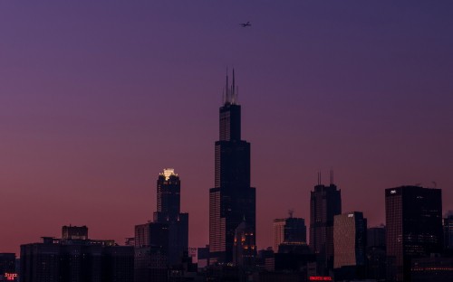 Image silhouette of high rise buildings during sunset