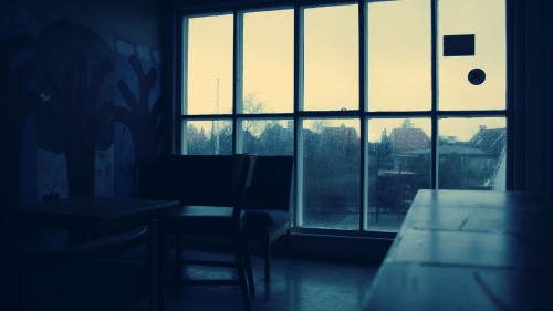 Image black wooden table near window