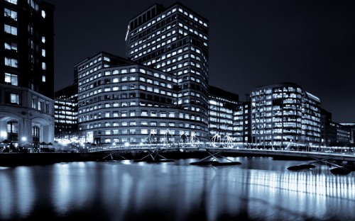 Image lighted high rise building during night time