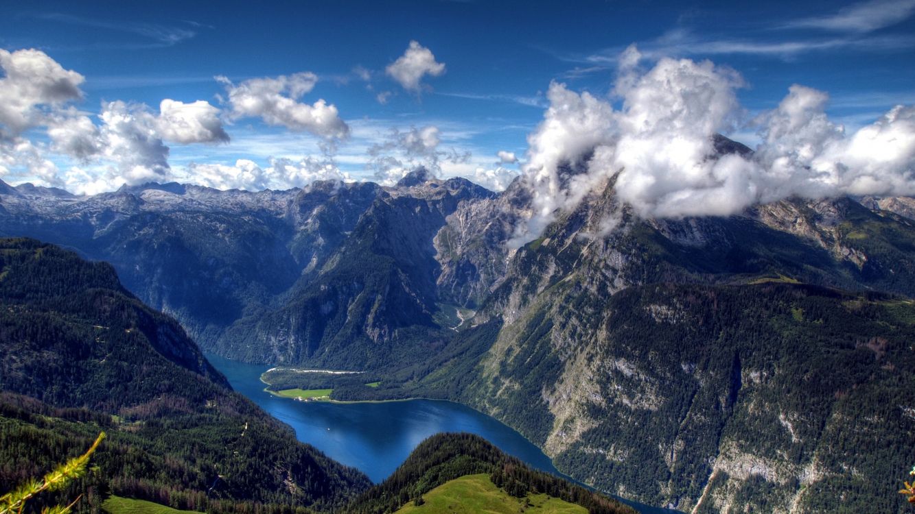 green and black mountains under blue sky and white clouds during daytime