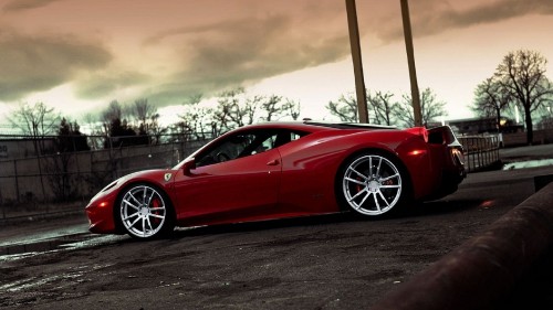 Image red ferrari 458 italia parked on gray asphalt road