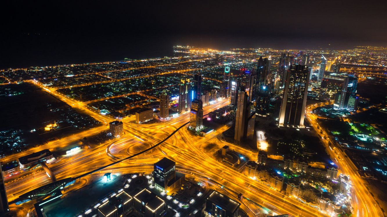 city with high rise buildings during night time