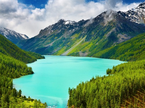 Image green mountains near lake under blue sky during daytime