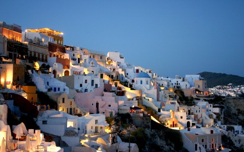 Image white concrete building on hill during daytime