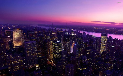 Image aerial view of city buildings during night time