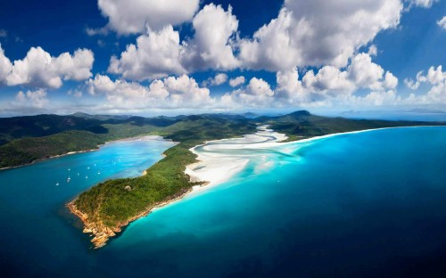 Image blue body of water under blue sky and white clouds during daytime