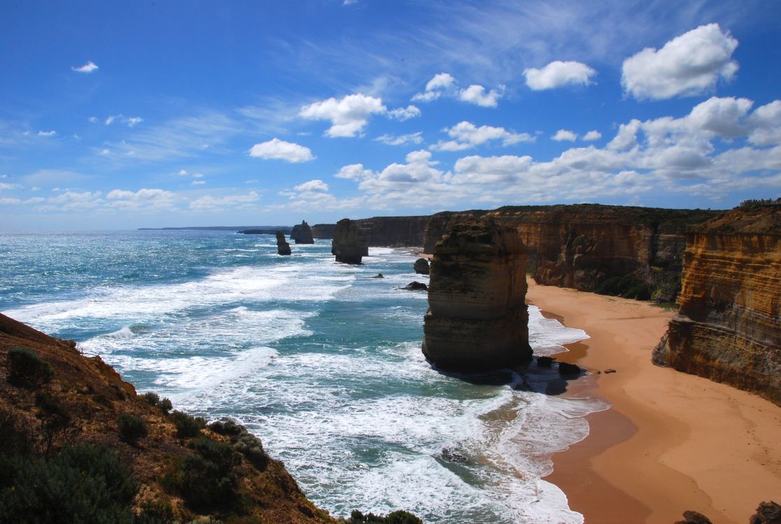 brown rock formation on sea shore during daytime