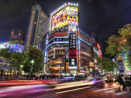 Image time lapse photography of city buildings during night time