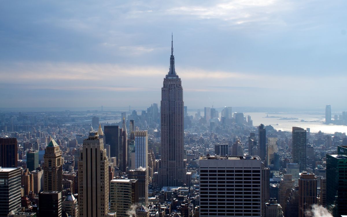 city skyline under blue sky during daytime