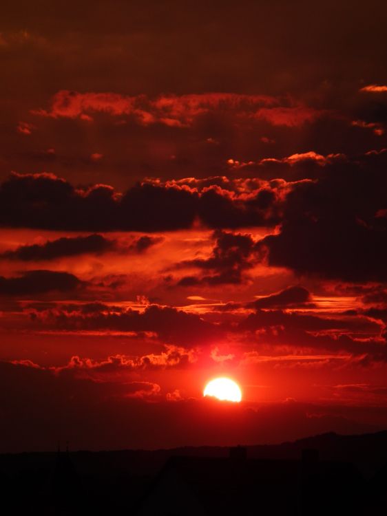 silhouette of clouds during sunset