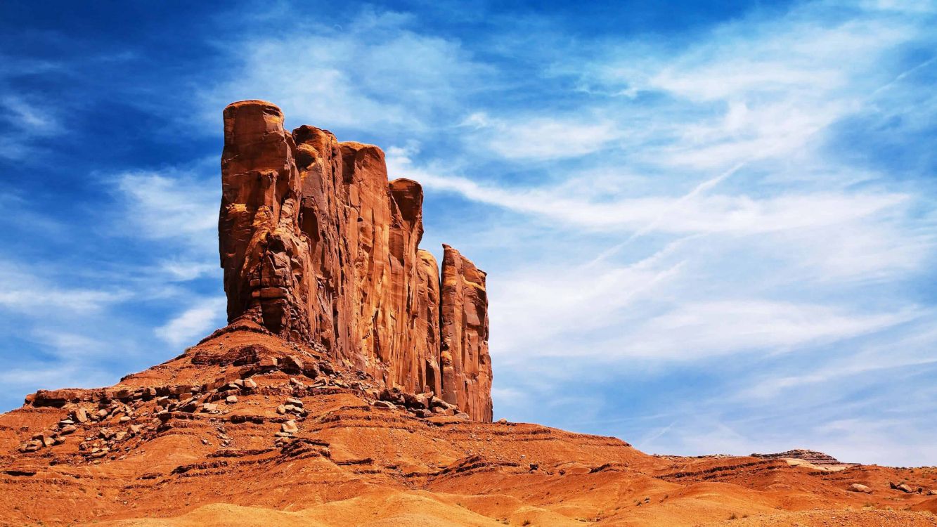 brown rock formation under blue sky during daytime