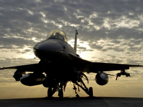 Image black fighter plane under white clouds during daytime