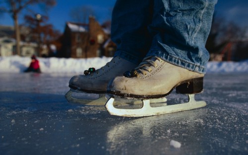 Image person in blue denim jeans and brown leather boots standing on gray concrete floor