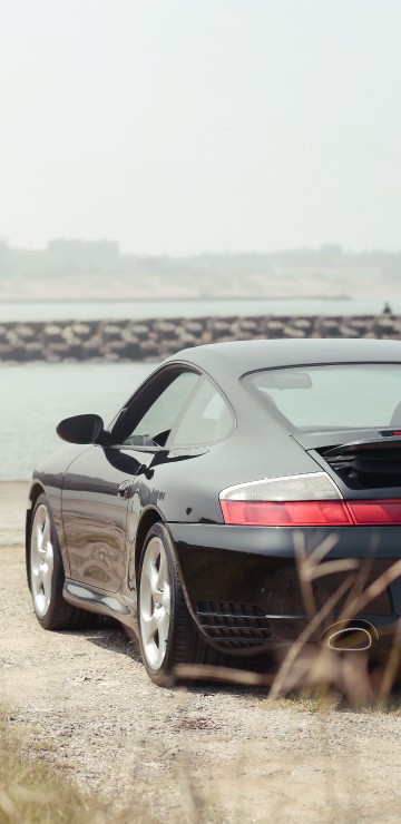 Image black bmw m 3 coupe on seashore during daytime