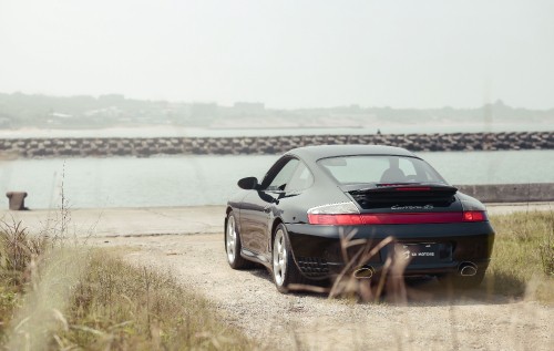 Image black bmw m 3 coupe on seashore during daytime