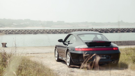 Image black bmw m 3 coupe on seashore during daytime