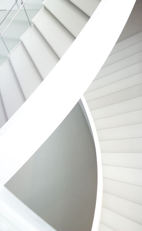 white concrete spiral staircase during daytime