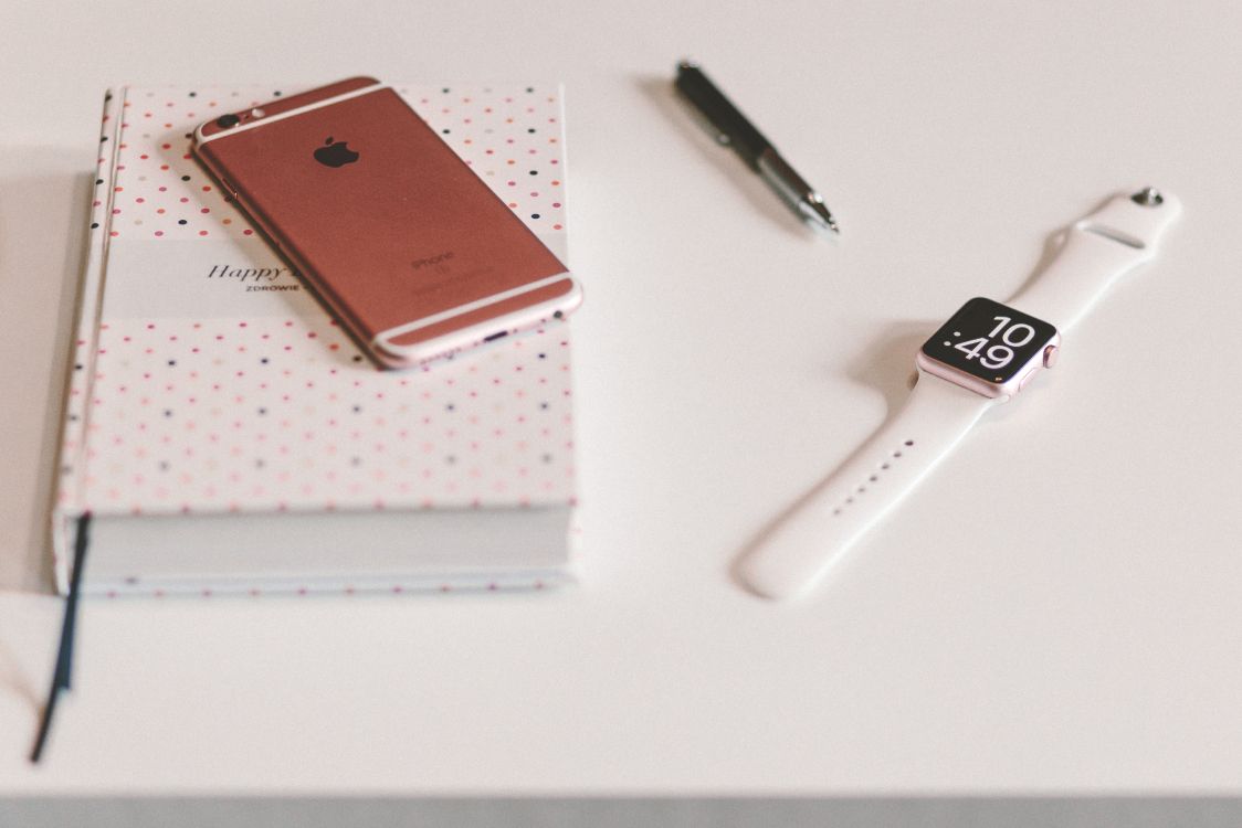 Silver Apple Watch With White Sport Band Beside Black Click Pen. Wallpaper in 4621x3081 Resolution