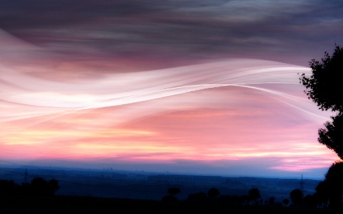 Image silhouette of mountain under orange and blue sky