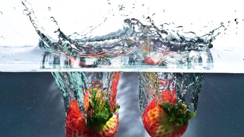 Image red strawberries in clear glass container