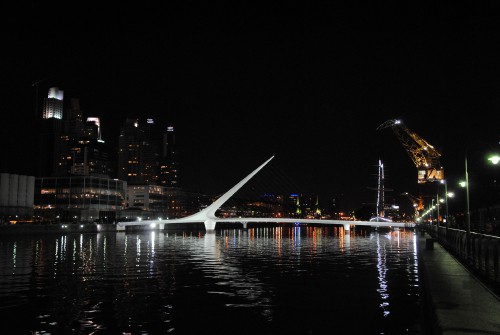 Image white bridge over body of water during night time