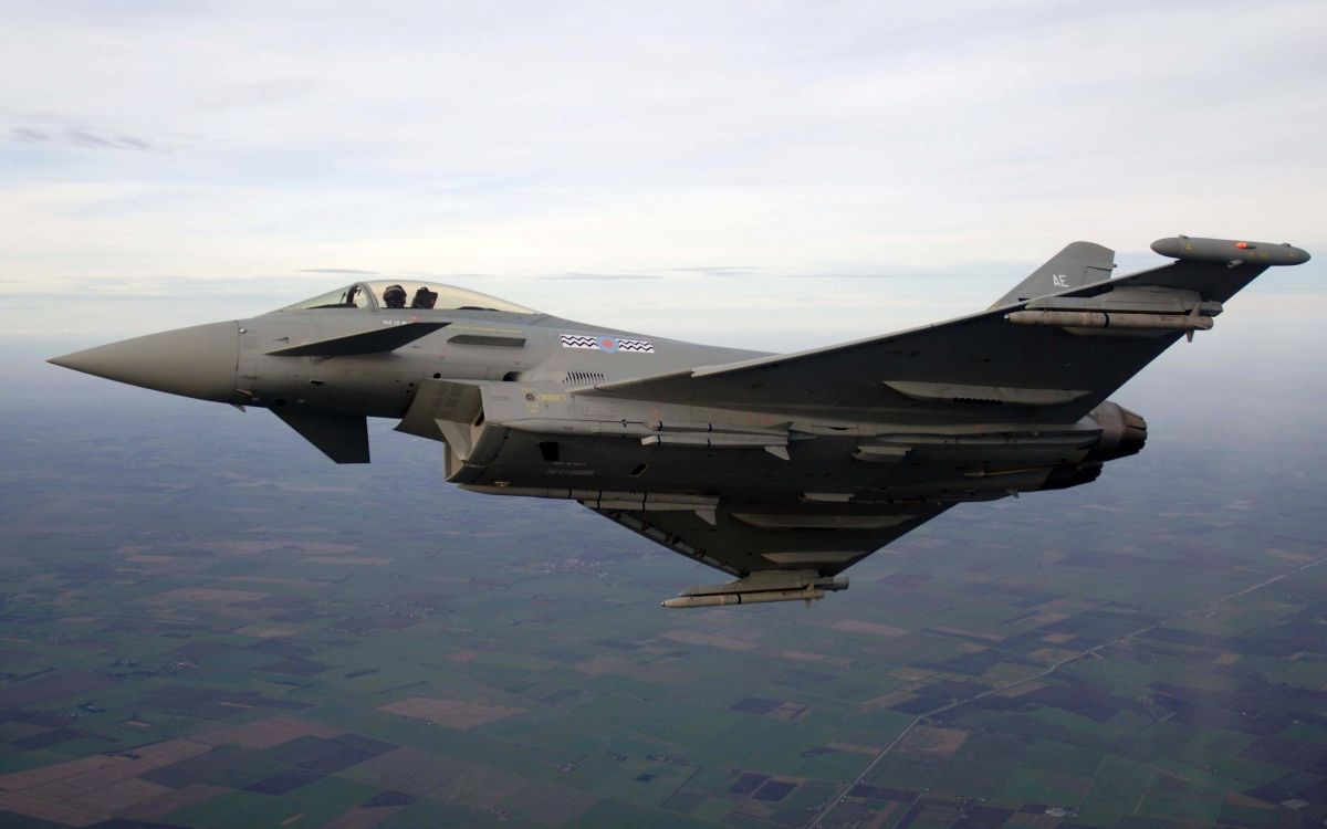 gray fighter jet flying over the sky during daytime