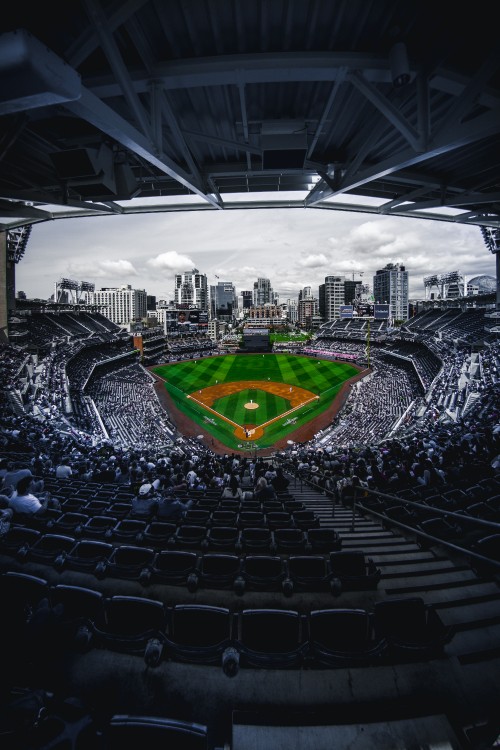 Image people sitting on stadium seats during daytime