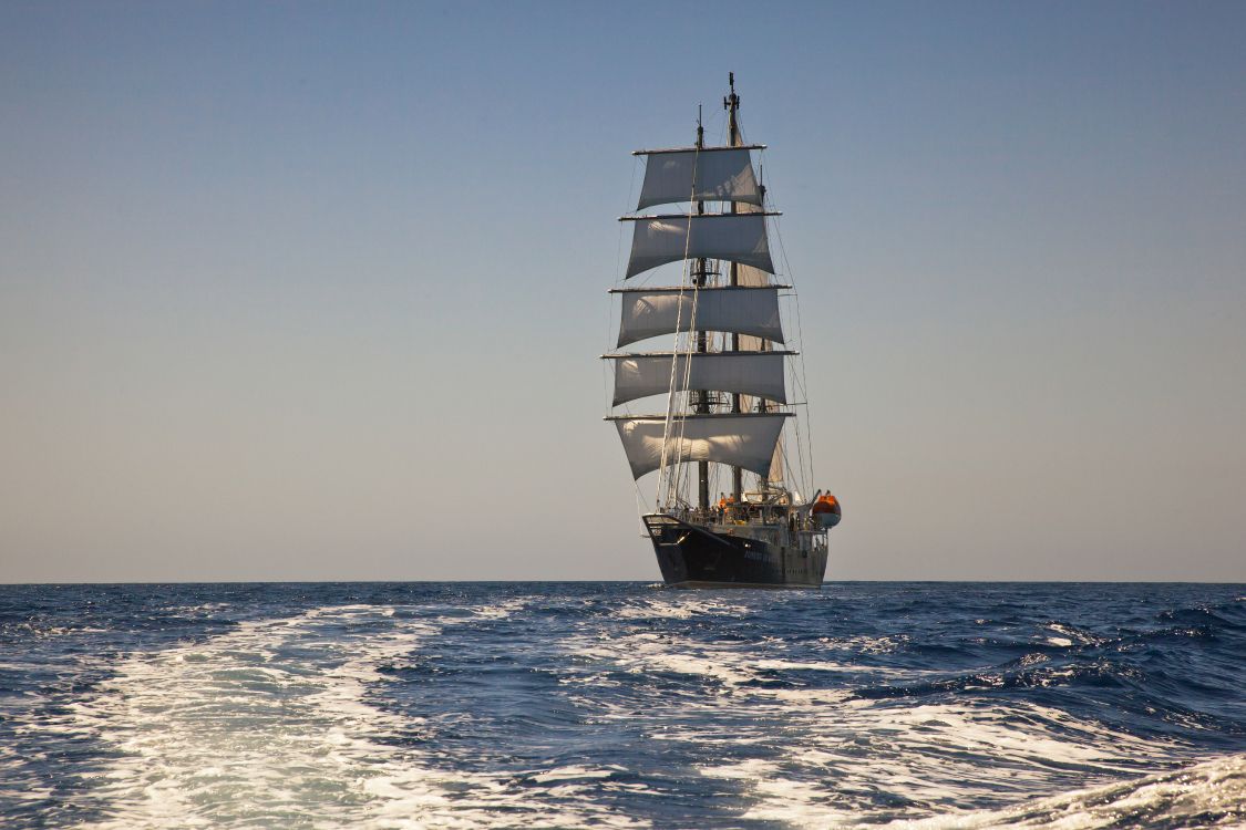 brown sail ship on sea during daytime