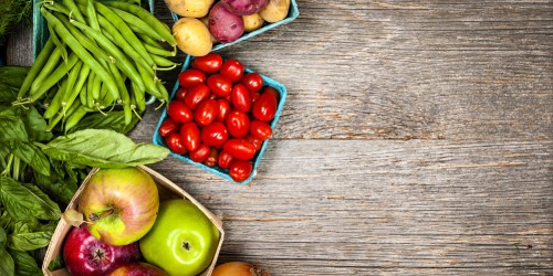 Image red round fruits on brown wooden table