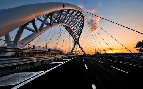 Image gray concrete bridge under blue sky during daytime